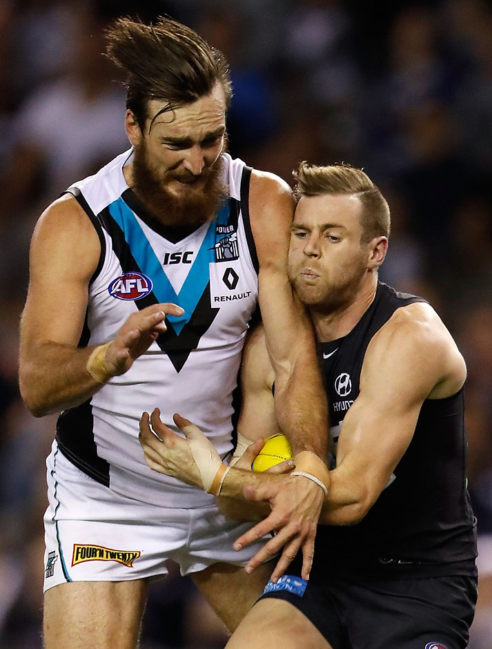 AFL 2016 Rd 08 - Carlton v Port Adelaide MELBOURNE, AUSTRALIA - MAY 15: Sam Docherty of the Blues is bumped by Charlie Dixon of the Power during the 2016 AFL Round 08 match between the Carlton Blues and Port Adelaide Power at Etihad Stadium, Melbourne on May 15, 2016. (Photo by Adam Trafford/AFL Media)